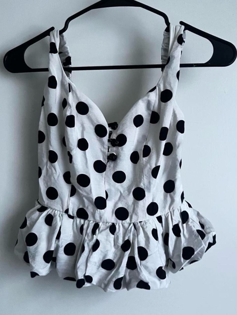 white peplum top with polka dots